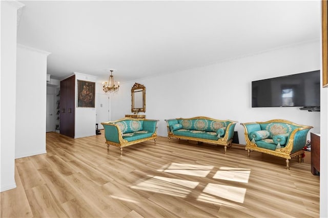 living area with light wood finished floors and an inviting chandelier