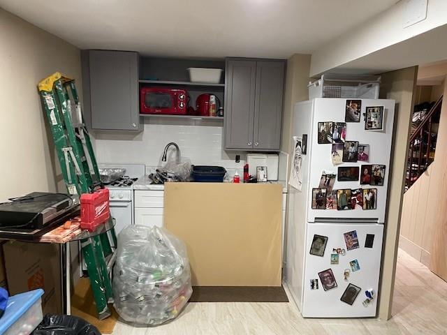 2195 Linden Blvd, Brooklyn, NY 11207 - kitchen with freestanding refrigerator, gray cabinets, and light countertops