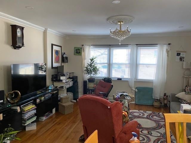 office with a notable chandelier, plenty of natural light, wood finished floors, and ornamental molding