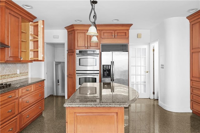 kitchen featuring stainless steel appliances, recessed lighting, granite finish floor, and decorative backsplash