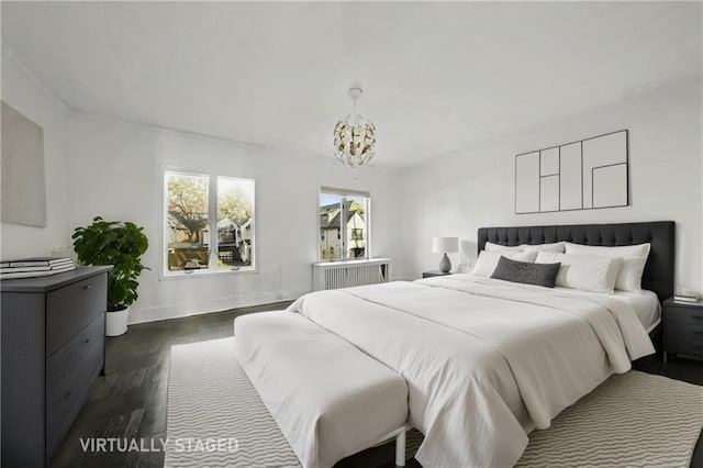 bedroom with a chandelier, dark wood-style flooring, and baseboards