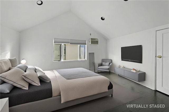 bedroom with high vaulted ceiling, a wall mounted AC, and wood finished floors