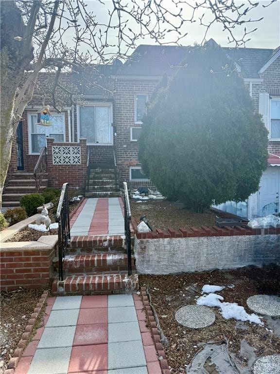 view of front of house with brick siding