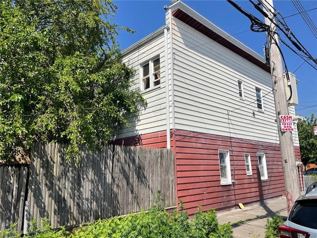 view of property exterior with fence