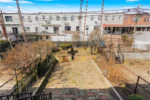 view of property's community featuring fence