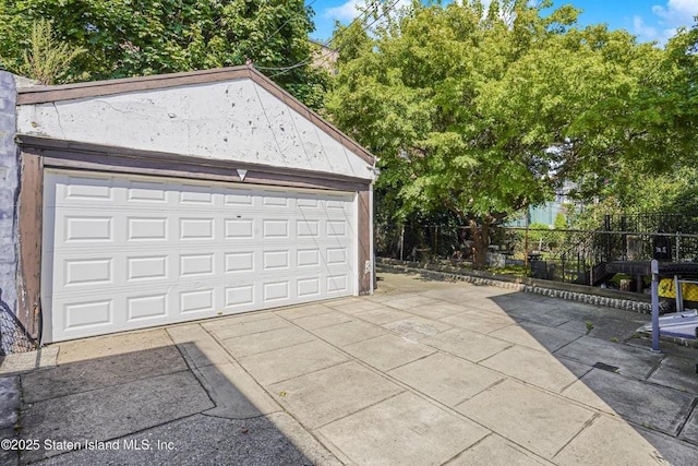 garage with fence