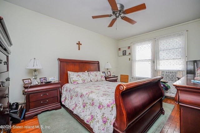 bedroom featuring ceiling fan and wood-type flooring