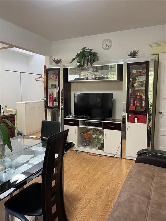 dining space featuring light wood finished floors