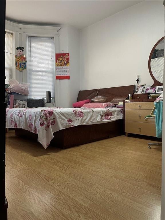 bedroom featuring wood finished floors