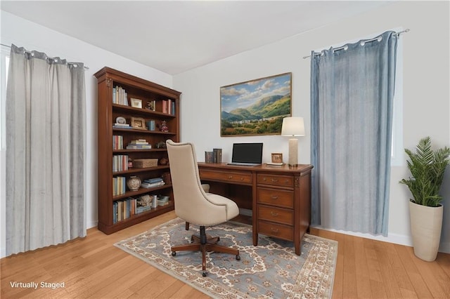 home office with wood finished floors