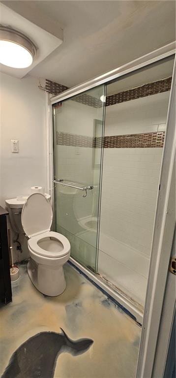 bathroom featuring concrete flooring, a stall shower, and toilet