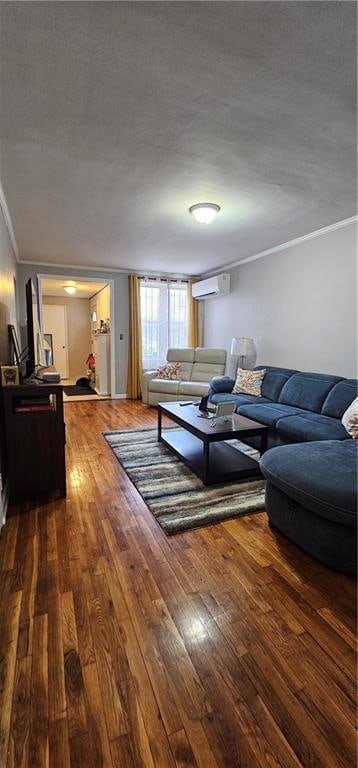 living room with ornamental molding, hardwood / wood-style floors, and a wall mounted AC