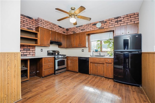 kitchen featuring black appliances, under cabinet range hood, open shelves, and light wood-style floors