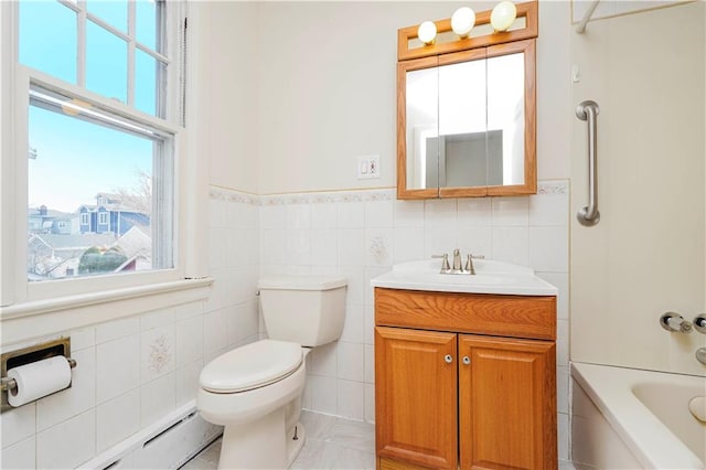 full bathroom featuring toilet, baseboard heating, tile walls, and vanity