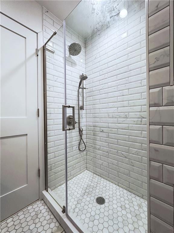 bathroom featuring a shower stall