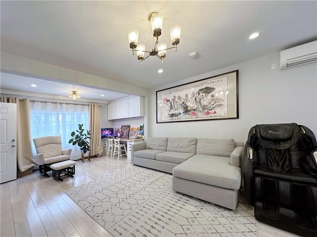 living area with light wood-style floors, recessed lighting, a wall unit AC, and a notable chandelier