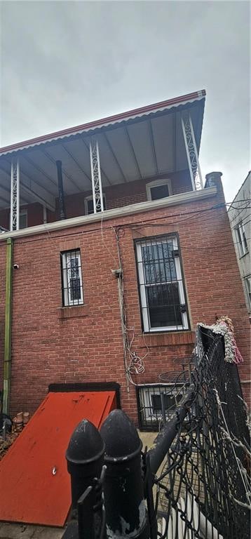 view of property exterior featuring brick siding