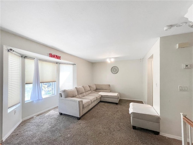 living room featuring carpet floors and baseboards