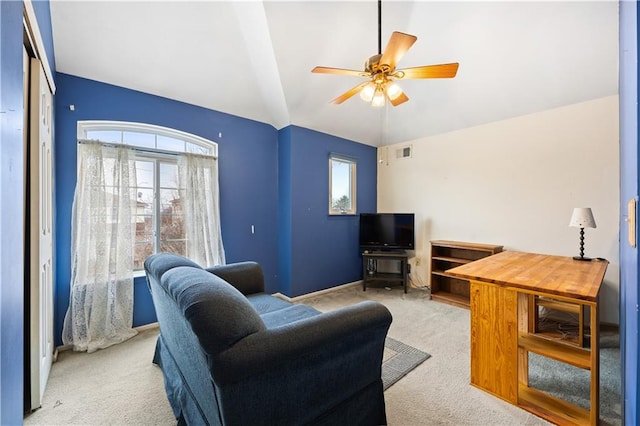 living area featuring carpet floors, lofted ceiling, visible vents, ceiling fan, and baseboards