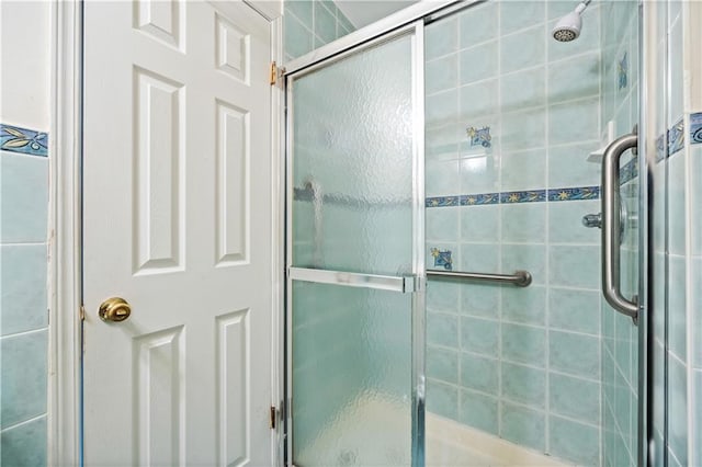 full bathroom with a shower stall