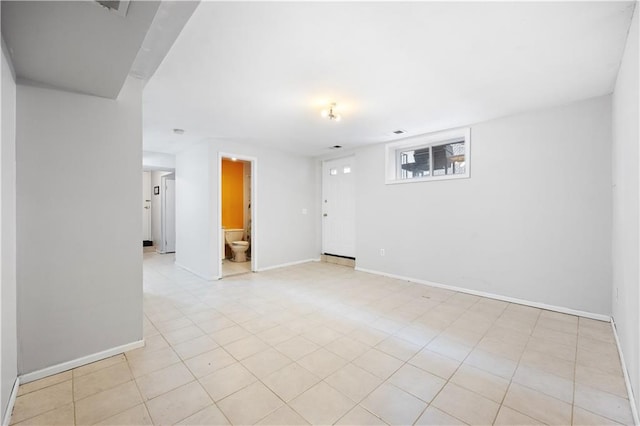 spare room featuring visible vents and baseboards