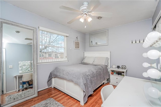 bedroom featuring ceiling fan and wood finished floors