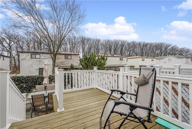 wooden deck with a residential view