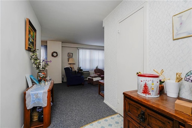 hallway featuring wallpapered walls and carpet flooring