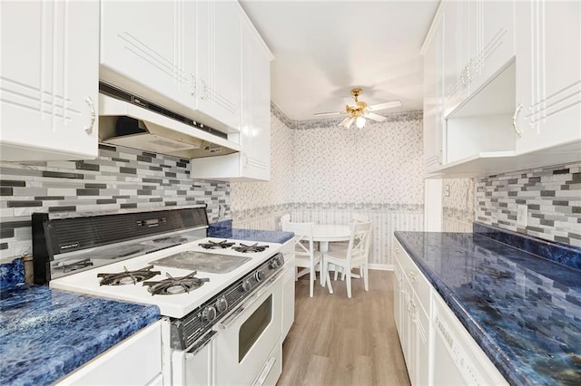 kitchen with ceiling fan, under cabinet range hood, white appliances, white cabinetry, and light wood-type flooring