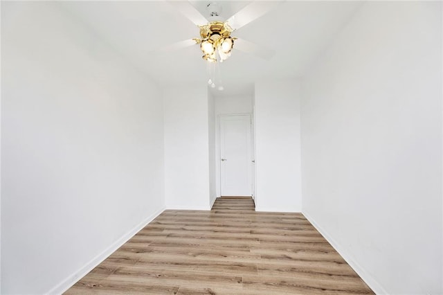 unfurnished room featuring a ceiling fan and light wood-style floors