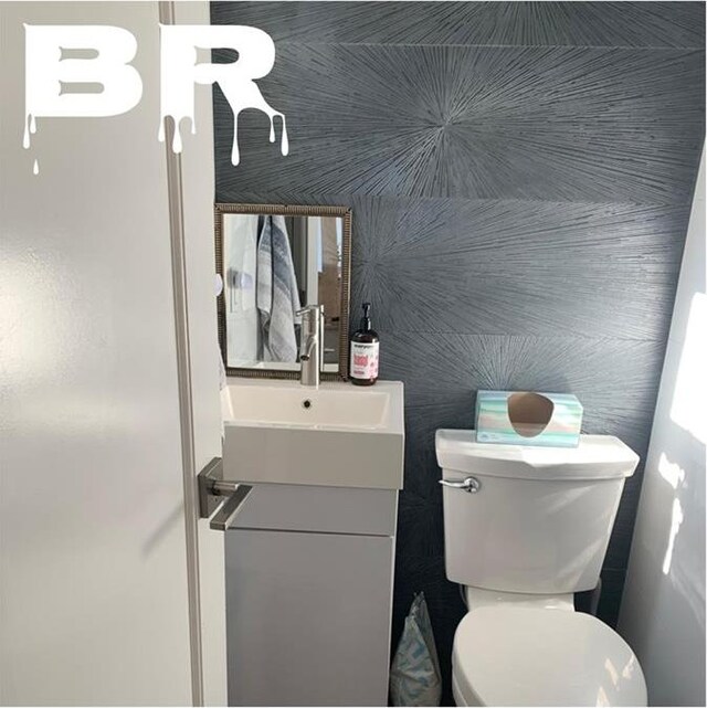 half bath with vanity and toilet