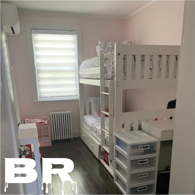 bedroom featuring an AC wall unit, crown molding, radiator, and dark wood-style floors