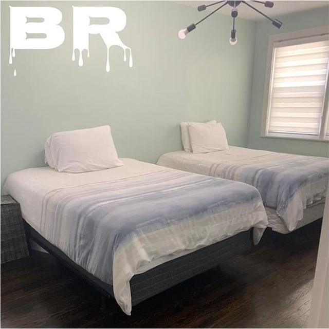 bedroom featuring wood finished floors