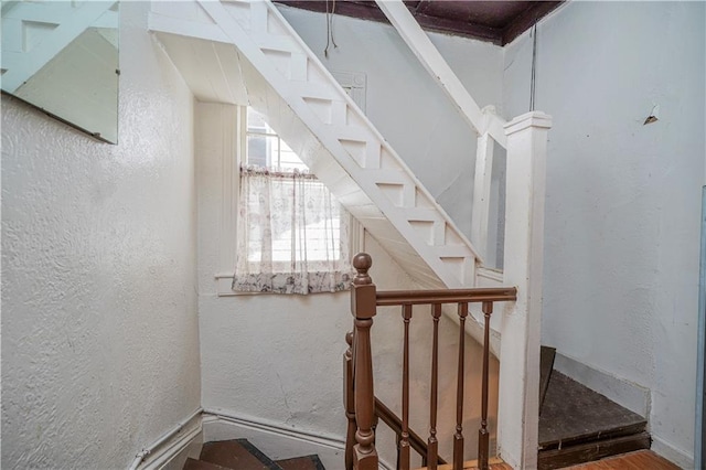 stairway with a textured wall