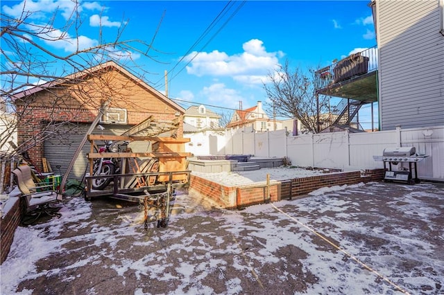 view of yard with fence and a vegetable garden