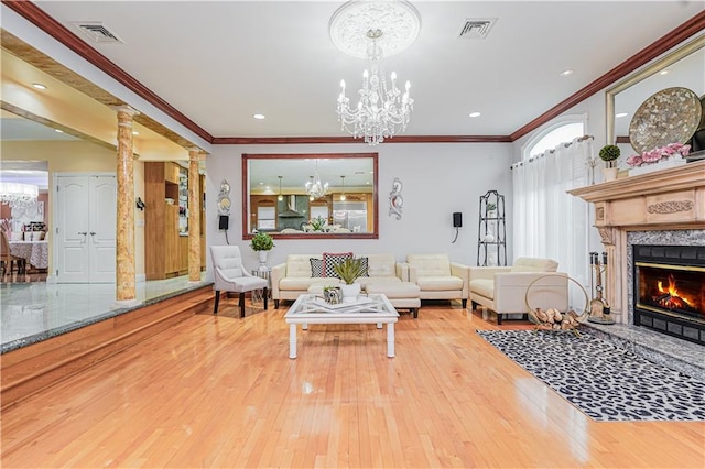 90 Giegerich Ave, Staten Island, NY 10307 - living room with wood-type flooring, crown molding, ornate columns, a fireplace, and a chandelier