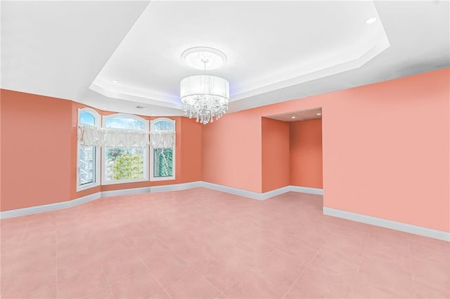 90 Giegerich Ave, Staten Island, NY 10307 - empty room featuring a tray ceiling, a chandelier, baseboards, and recessed lighting