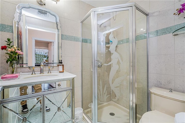 90 Giegerich Ave, Staten Island, NY 10307 - bathroom featuring tile walls, toilet, a stall shower, and vanity