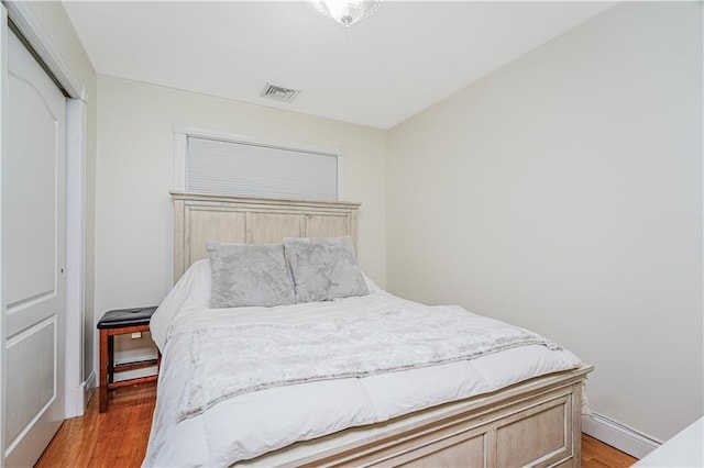 90 Giegerich Ave, Staten Island, NY 10307 - bedroom featuring light wood-type flooring, a closet, and baseboards