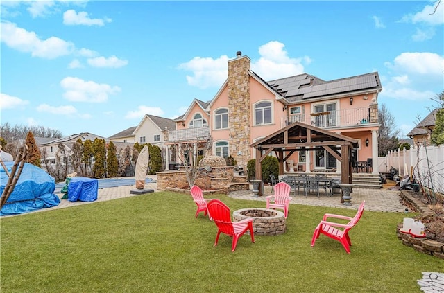 90 Giegerich Ave, Staten Island, NY 10307 - back of house featuring a fire pit, a gazebo, a chimney, a patio, and stucco siding