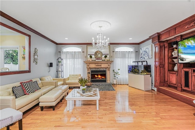 90 Giegerich Ave, Staten Island, NY 10307 - living area featuring ornamental molding, light wood-style flooring, a chandelier, a lit fireplace, and recessed lighting