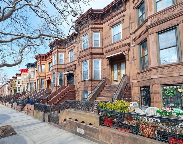 view of building exterior with a fenced front yard