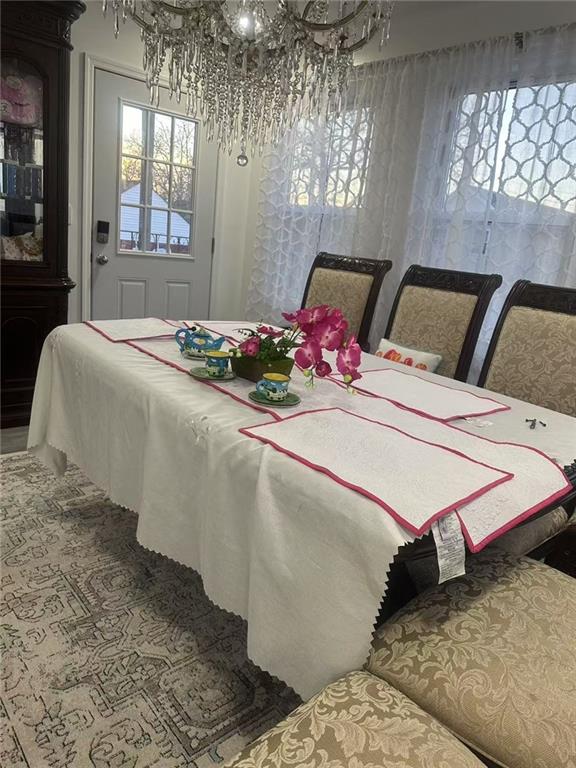295 Clifton St, Staten Island, NY 10305 - dining space with a chandelier