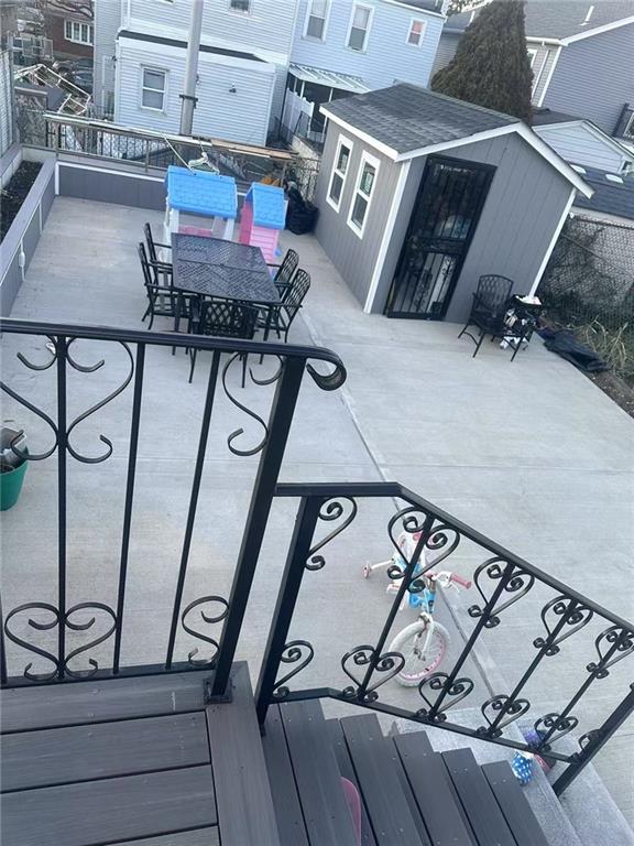 295 Clifton St, Staten Island, NY 10305 - wooden deck with an outdoor structure and outdoor dining space