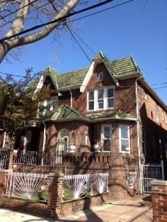 exterior space with brick siding