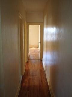 corridor with wood finished floors