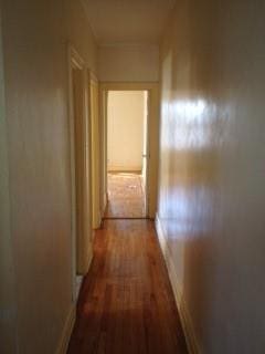 737 E 48th St, Brooklyn, NY 11203 - corridor featuring wood finished floors and baseboards