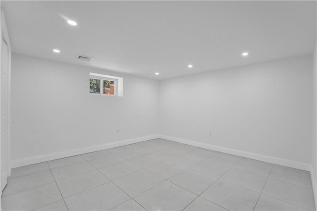 below grade area featuring recessed lighting, visible vents, and baseboards