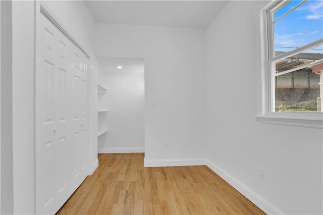 interior space with light wood-style flooring and baseboards