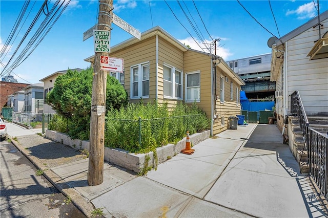 view of property exterior with fence